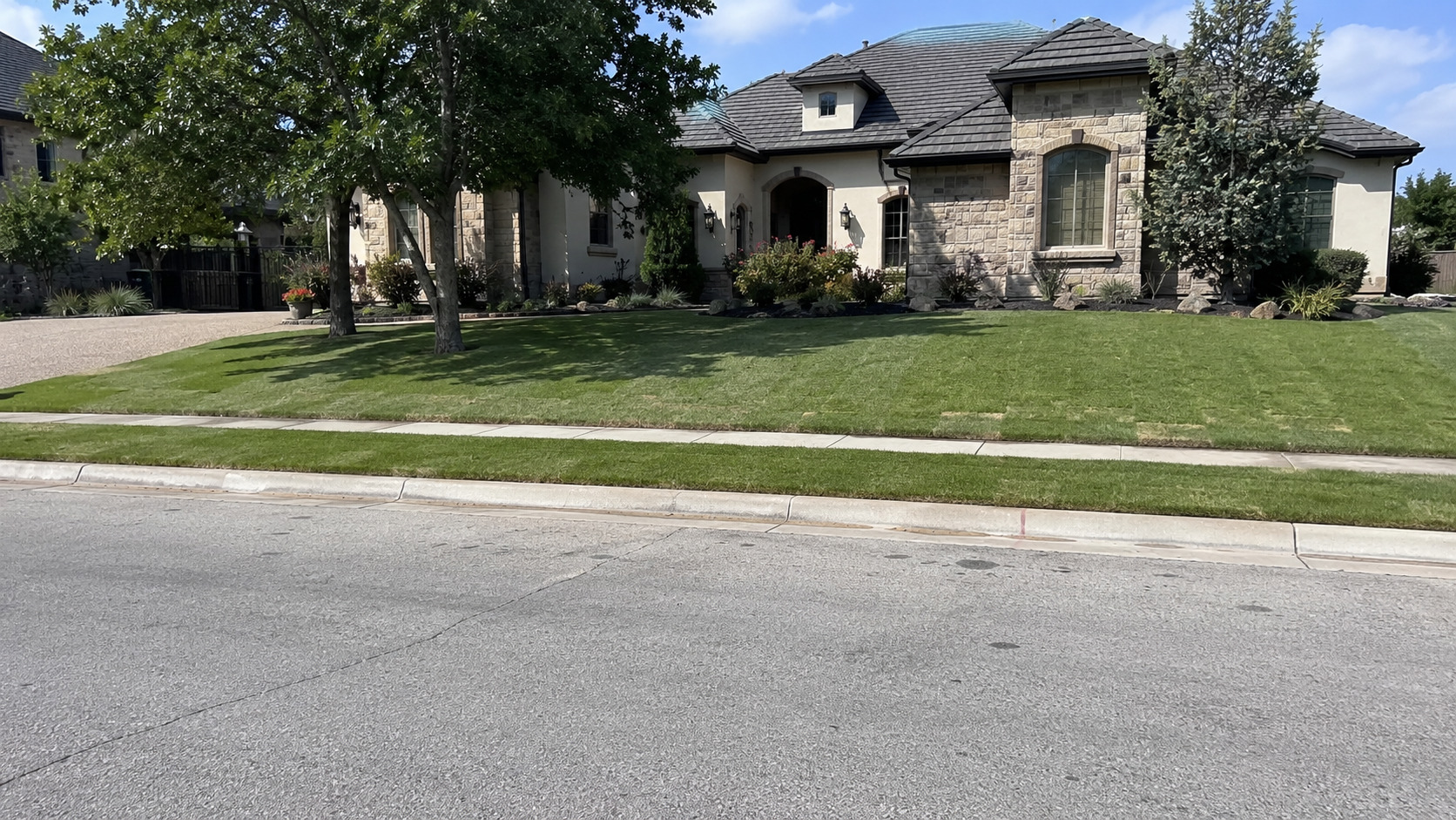 Finished front-yard sod lawn in front of a house